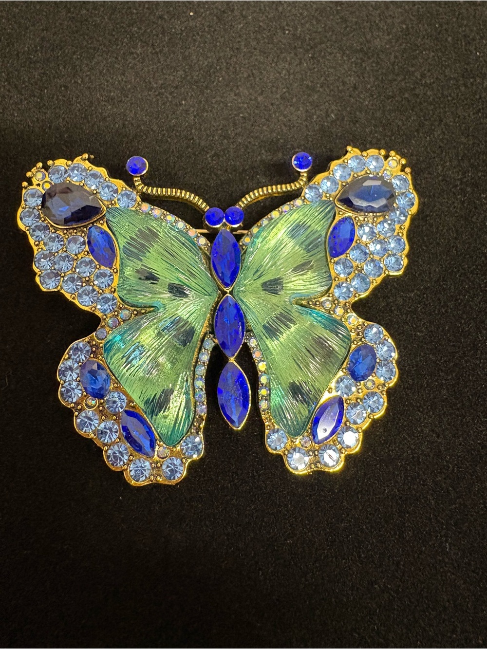 Large Blue, green, and goldtone butterfly brooch.